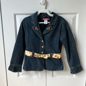 Girl’s jean jacket with floral embroidery and floral belt.